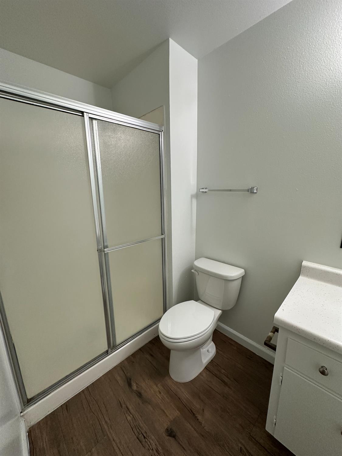1069 Cherry Lane, Unit D Clovis, CA 93612 - Photo 16 of 18 a bathroom with a toilet and a shower