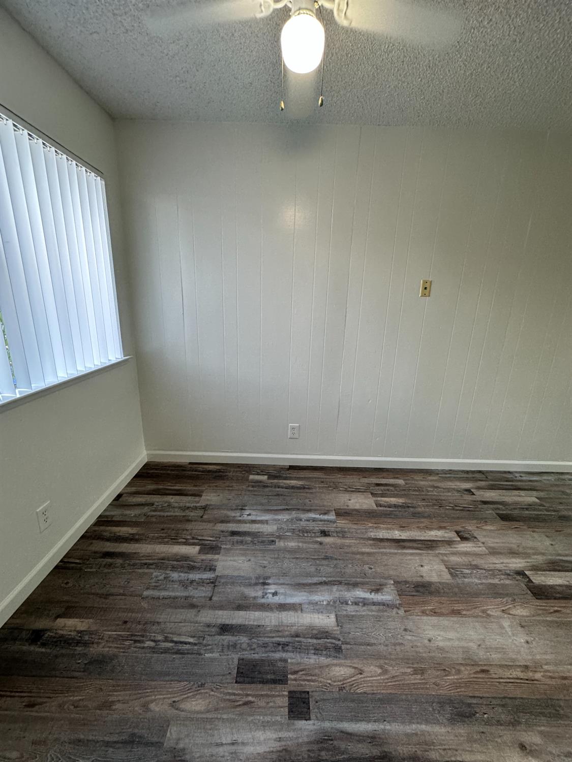 1069 Cherry Lane, Unit D Clovis, CA 93612 - Photo 8 of 18 a view of wooden floor and window in a room