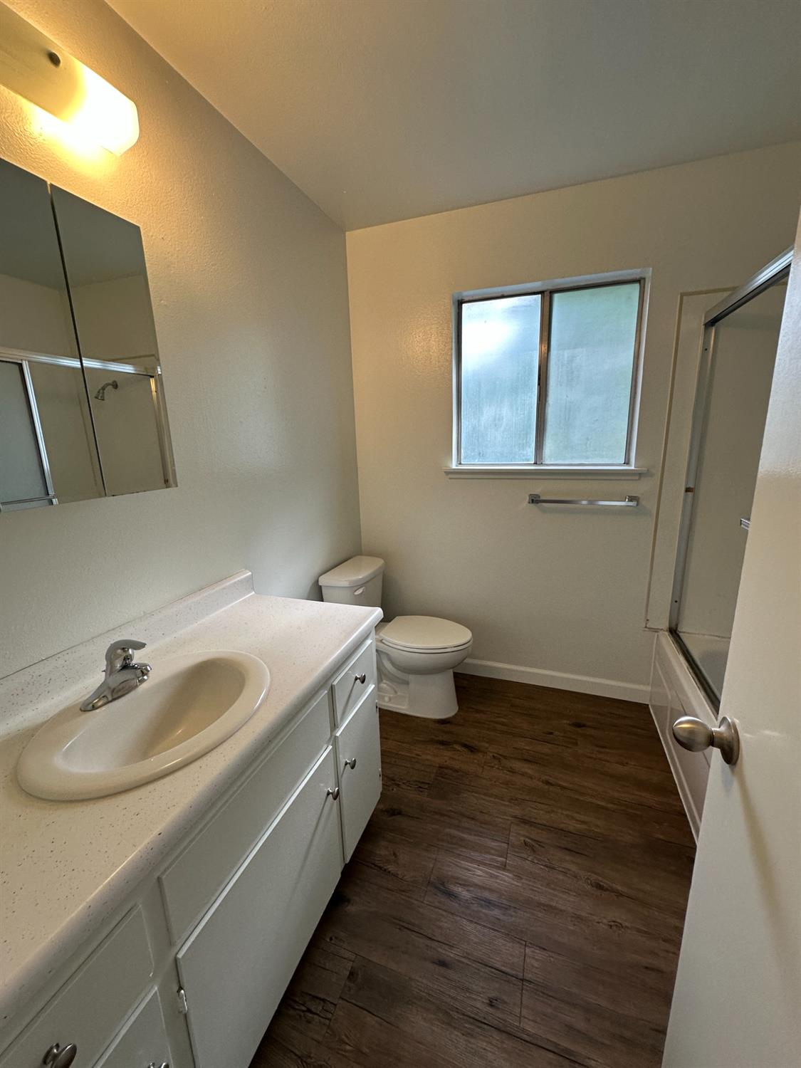 1069 Cherry Lane, Unit D Clovis, CA 93612 - Photo 10 of 18 a bathroom with a sink and a mirror