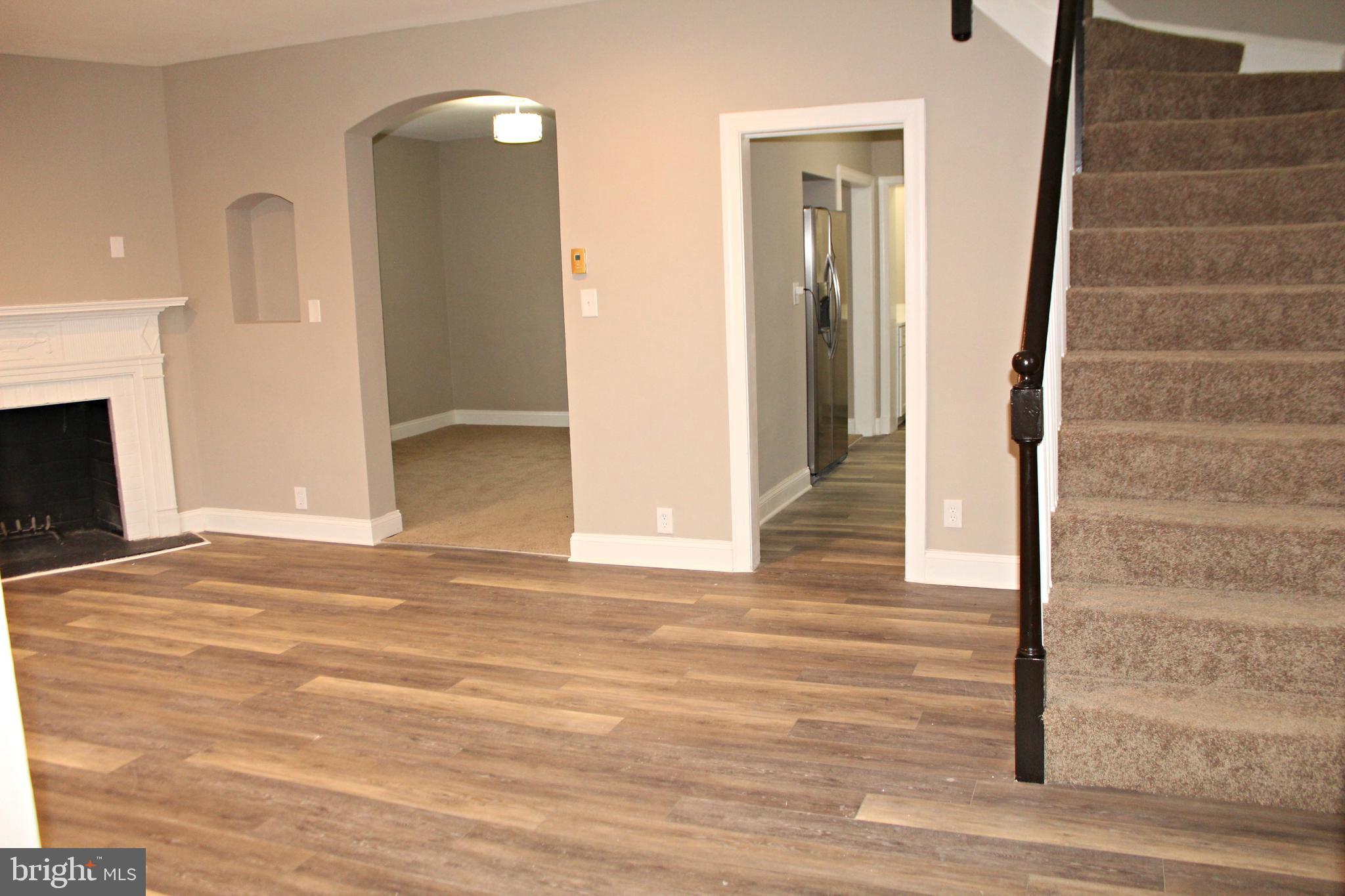 3608 Dennlyn Road Baltimore, MD 21215 - Photo 11 of 26 Large living room with luxury vinyl plank flooring