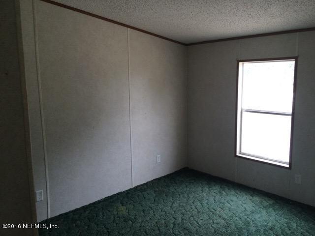 174 Gorbutt Road Crescent City, FL 32112 - Photo 3 of 13 a view of a room that has a window in it