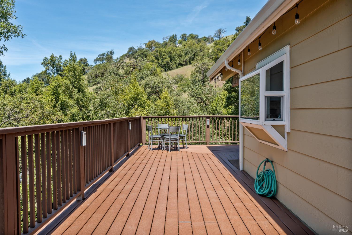 14590 Ridgeview Road Willits, CA 95490 - Photo 20 of 37 a balcony with wooden floor and potted plants