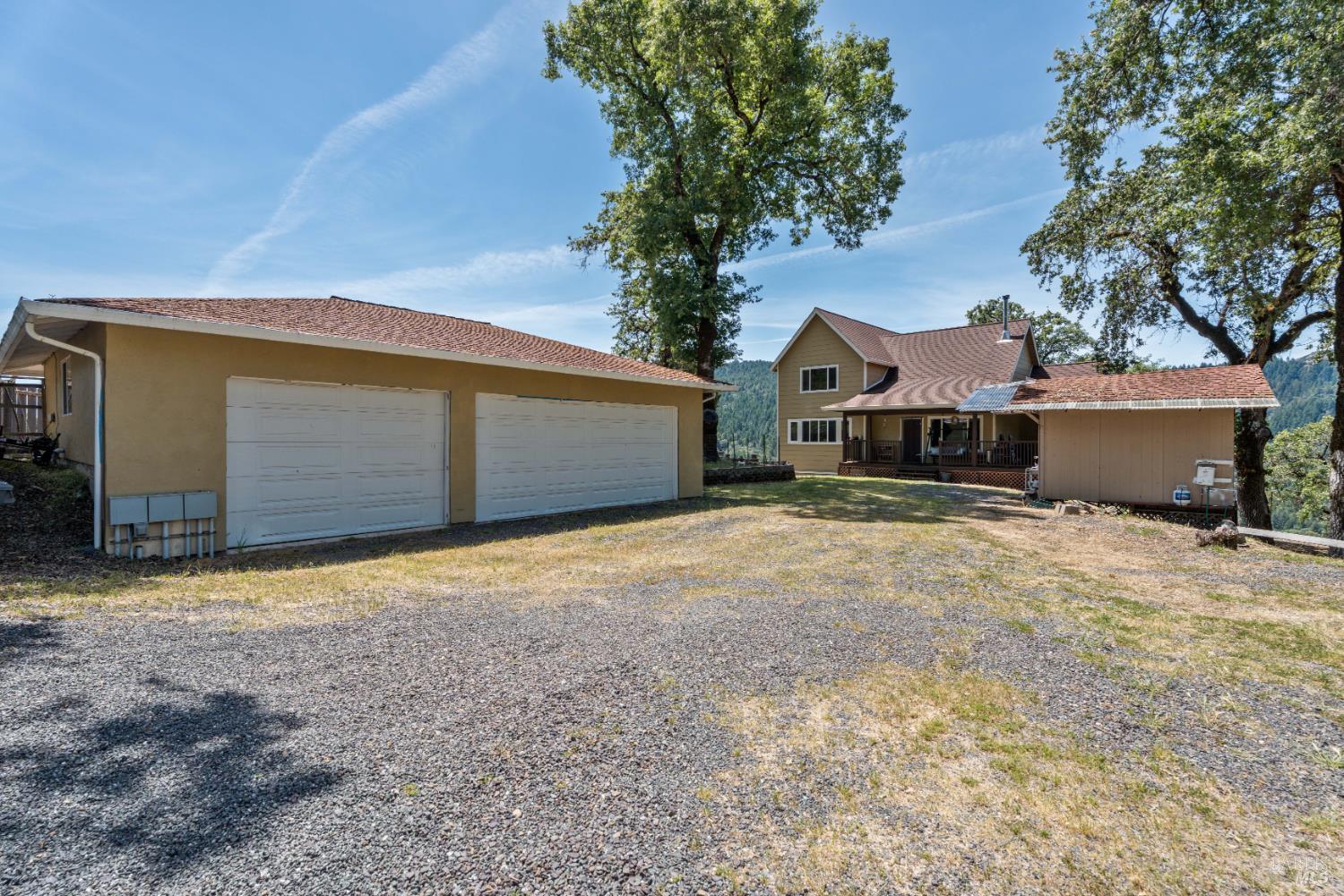 14590 Ridgeview Road Willits, CA 95490 - Photo 2 of 37 a house with trees in front of it