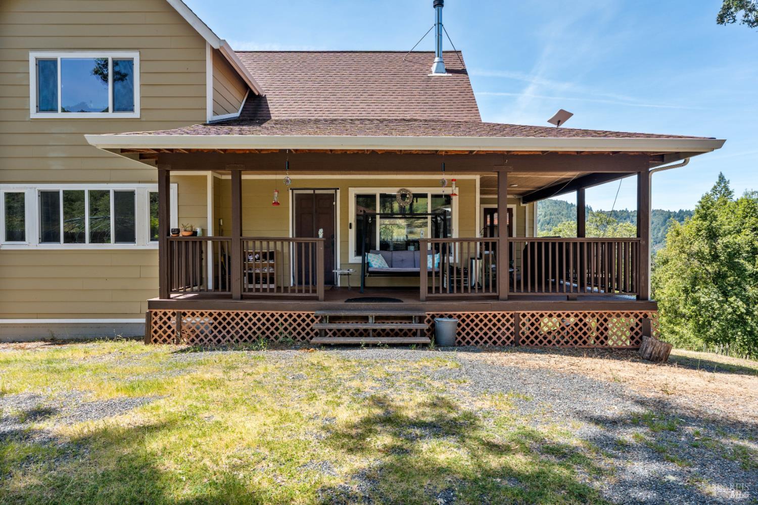 14590 Ridgeview Road Willits, CA 95490 - Photo 24 of 37 a front view of a house with a garden