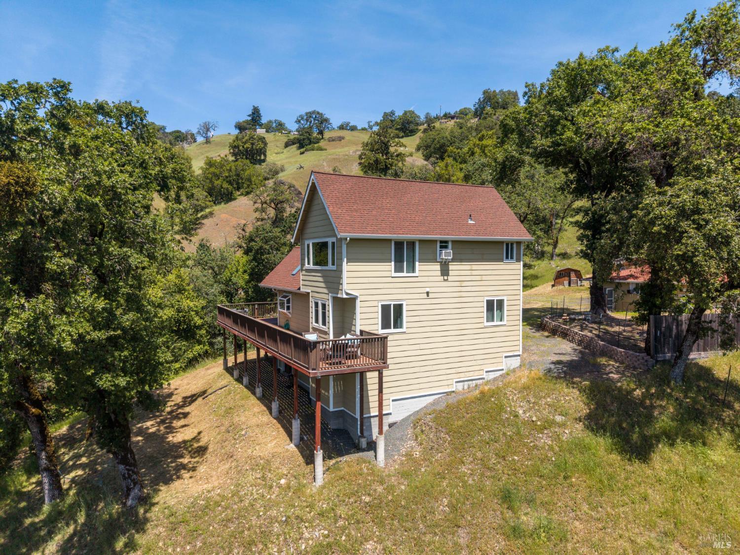 14590 Ridgeview Road Willits, CA 95490 - Photo 27 of 37 a aerial view of a house with yard and trees in the background