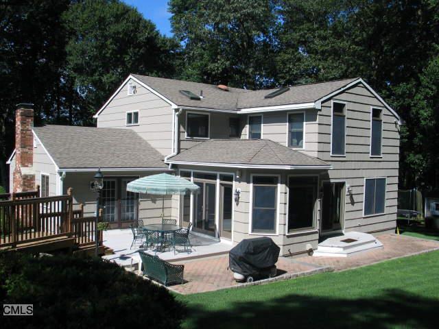 a aerial view of a house with garden and porch