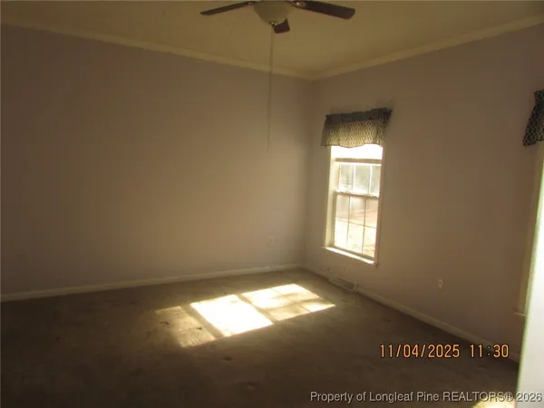 a view of empty room with windows