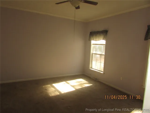 a view of empty room with windows