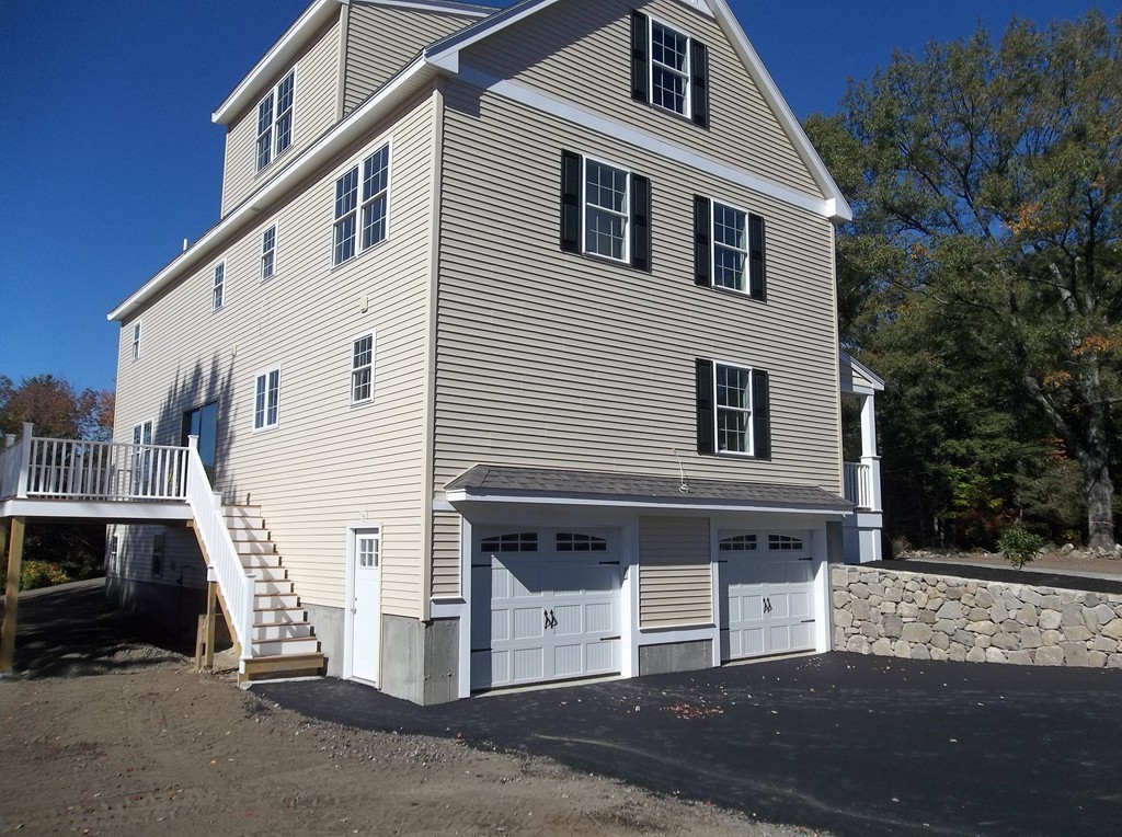 394 High Plain Road Andover, MA 01810 - Photo 3 of 29 a front view of a house with garage