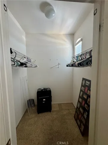 a bedroom with a bed furniture and a window