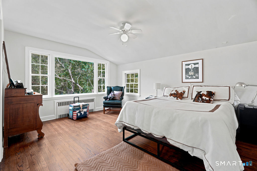 261-1 Grassy Hill Road Lyme, CT 06371 - Photo 23 of 40 Privately situated, this bedroom enjoys views of the front courtyard and is complemented by a full bath conveniently located just outside the door.
