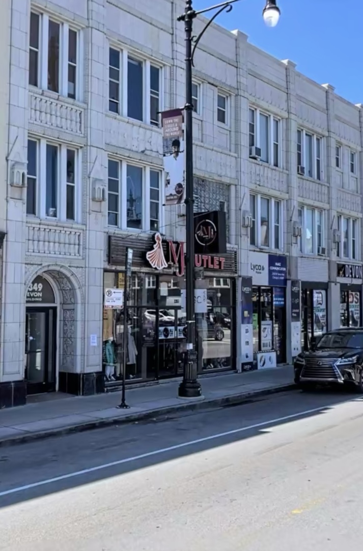 a front view of a building with street