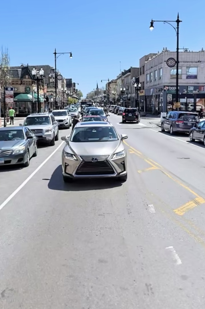2349 West Devon Avenue, Unit 3F Chicago, IL 60659 - Photo 3 of 6 a cars parked in a parking lot