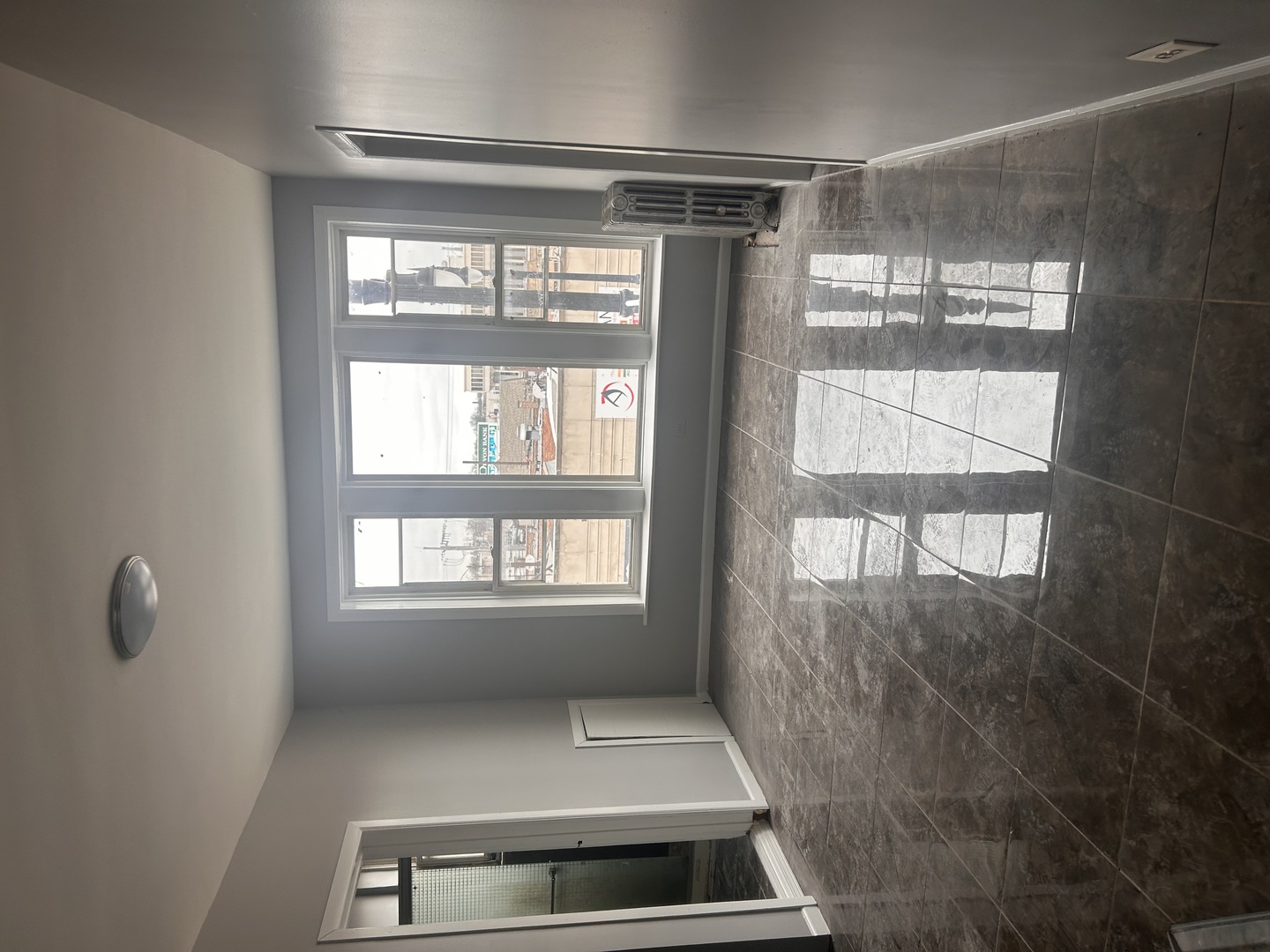 2349 West Devon Avenue, Unit 3F Chicago, IL 60659 - Photo 6 of 6 a view of an empty room with a window