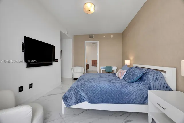 a bedroom with a bed and furniture