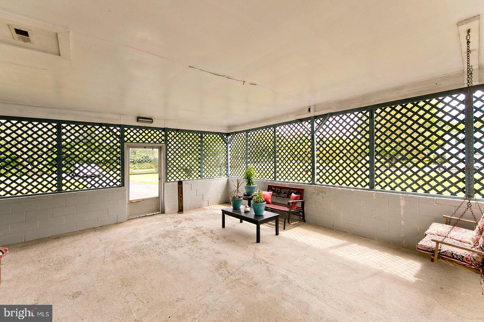 449 Ruebuck Road Clear Brook, VA 22624 - Photo 5 of 34 Large attached covered sun porch
