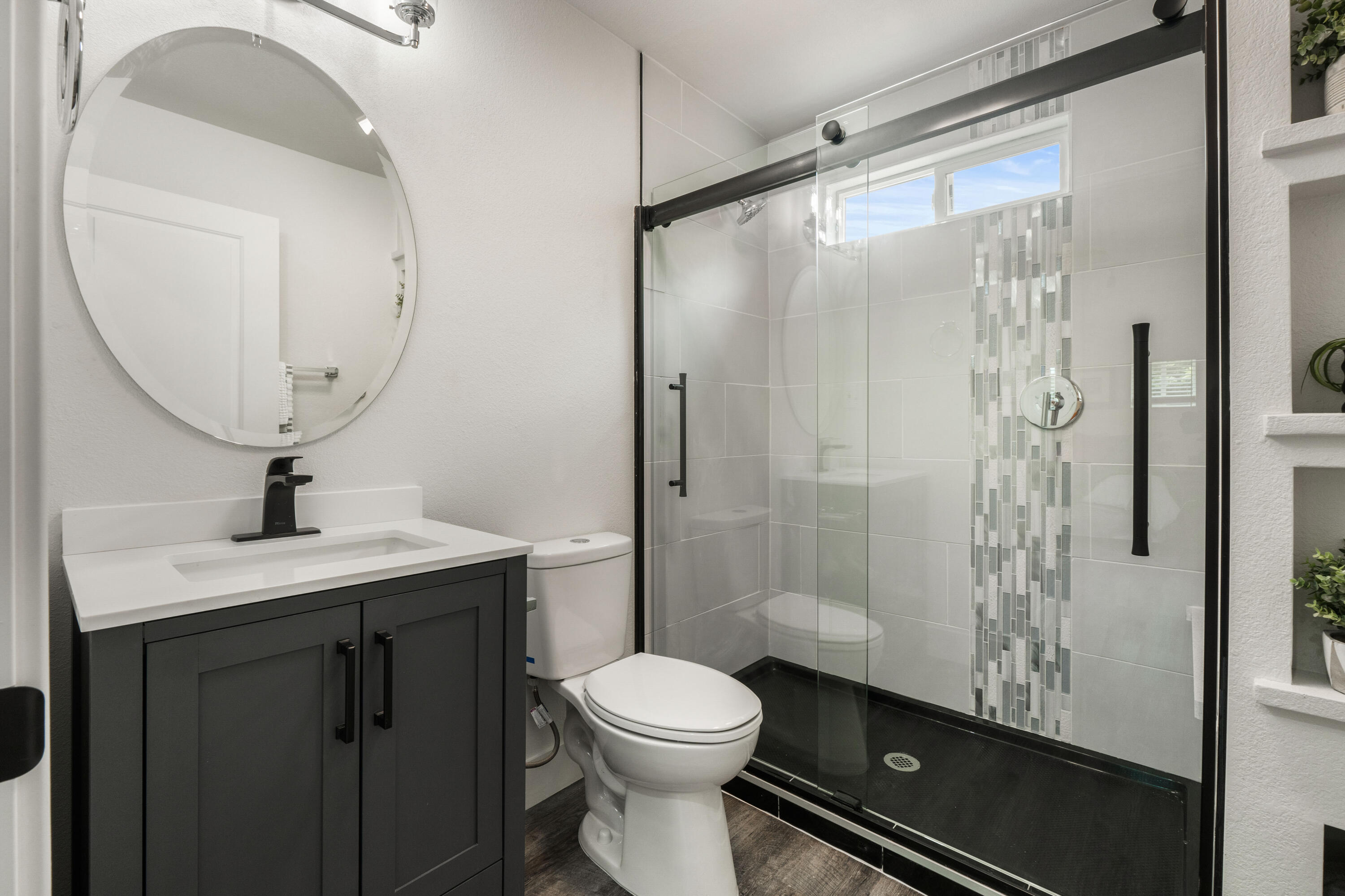 2712 Irwin Road Redding, CA 96002 - Photo 17 of 34 a bathroom with a granite countertop sink toilet and shower