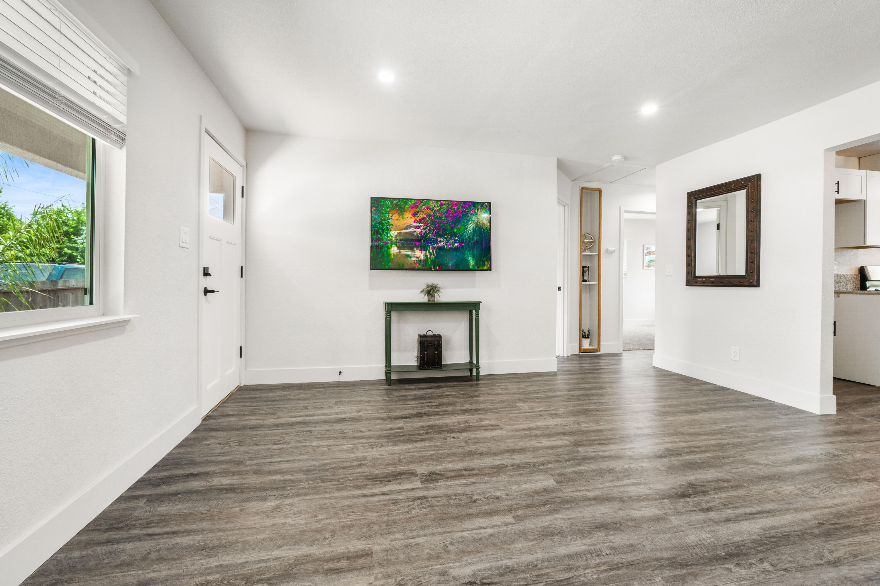 2712 Irwin Road Redding, CA 96002 - Photo 6 of 34 a view of a livingroom with wooden floor and a fireplace