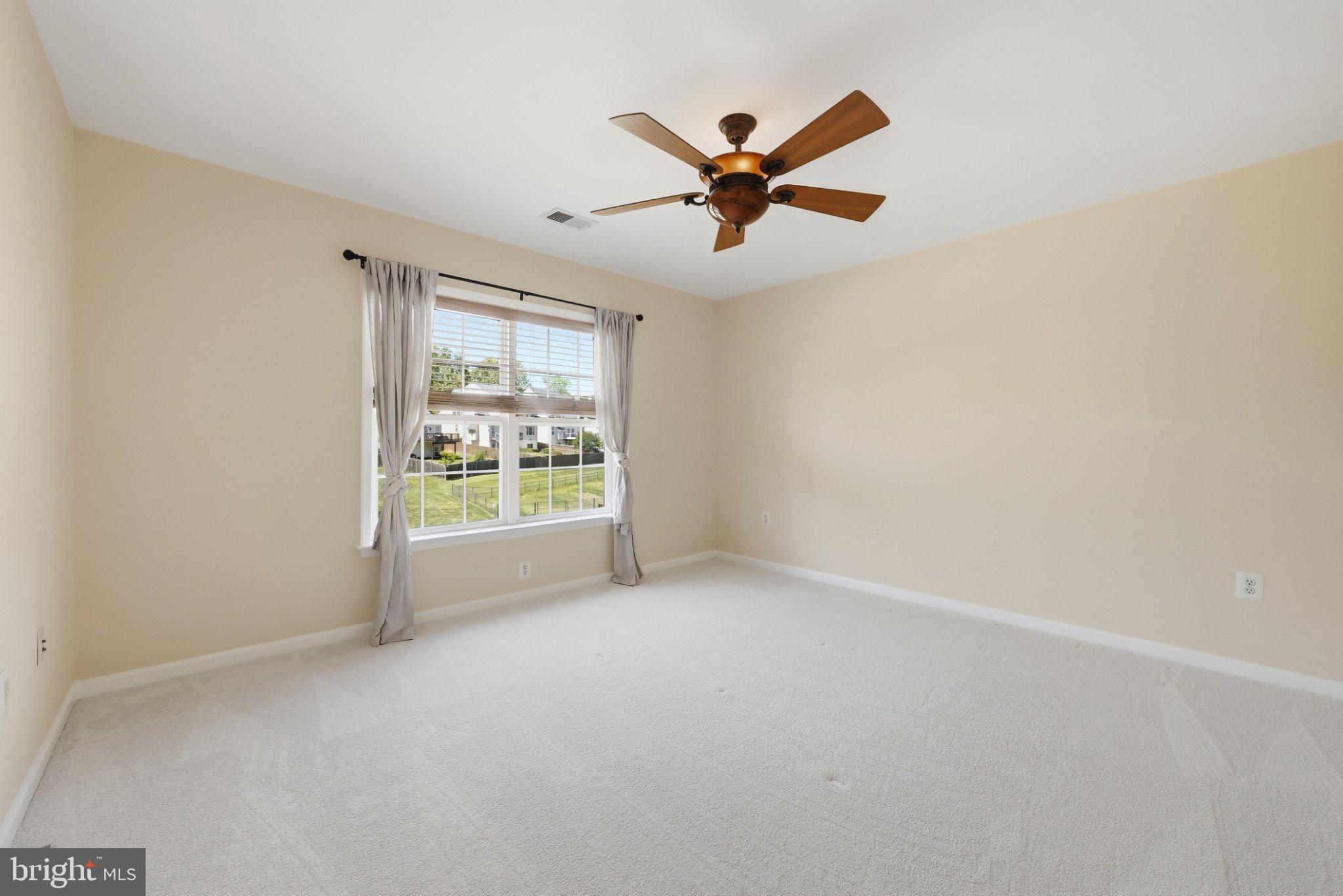 3679 Expedition Drive Triangle, VA 22172 - Photo 25 of 65 a view of a big room with wooden floor and windows