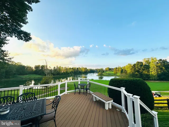 a view of a hallway with the wooden floor and staircase