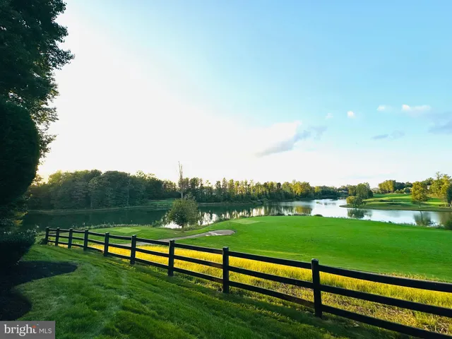 a large kitchen with stainless steel appliances granite countertop a large stove a sink and a refrigerator