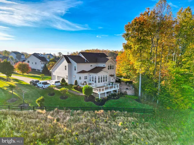 a view of a house with wooden deck