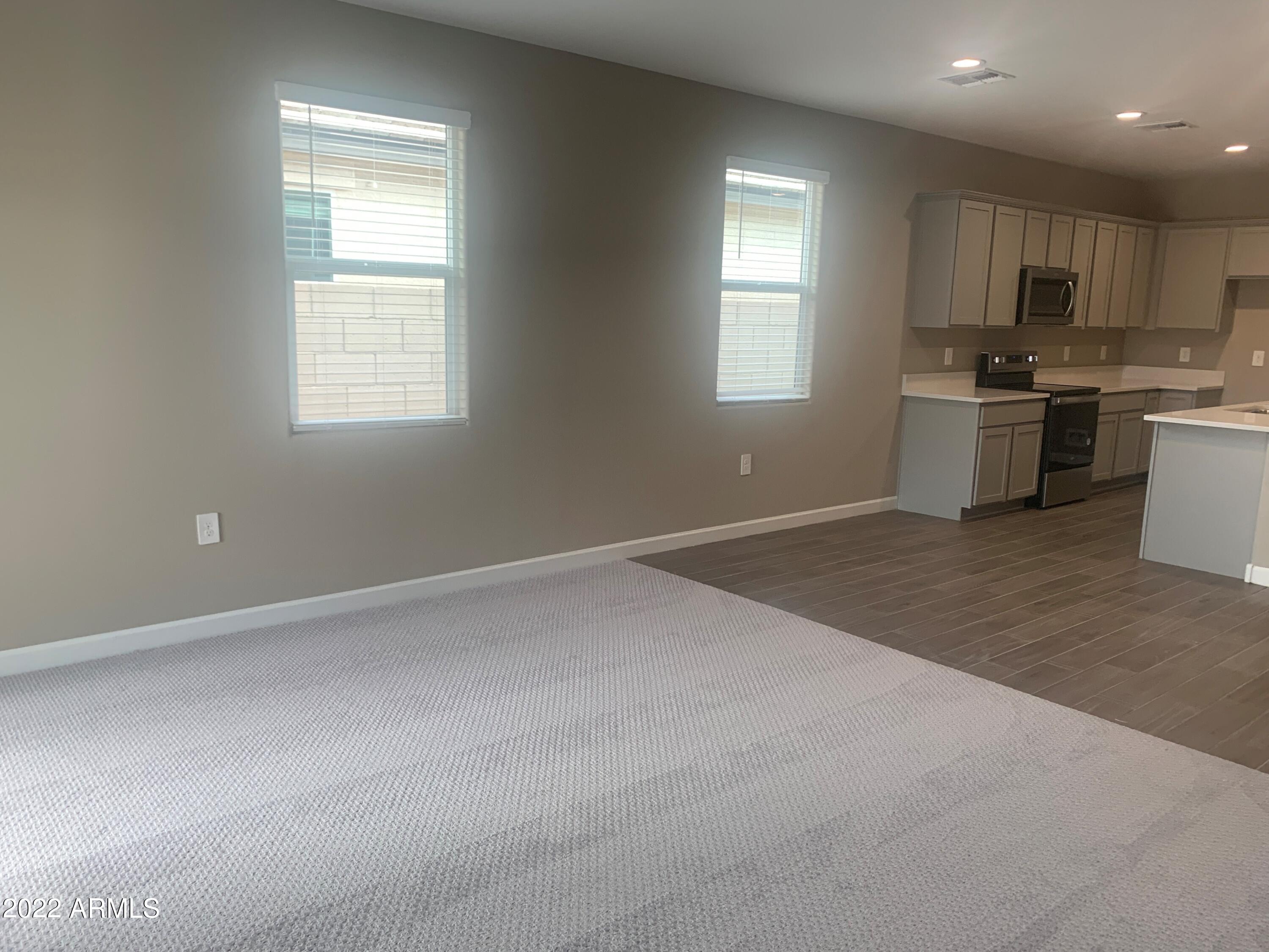 23944 West Ripple Road Buckeye, AZ 85326 - Photo 5 of 15 Great room 4