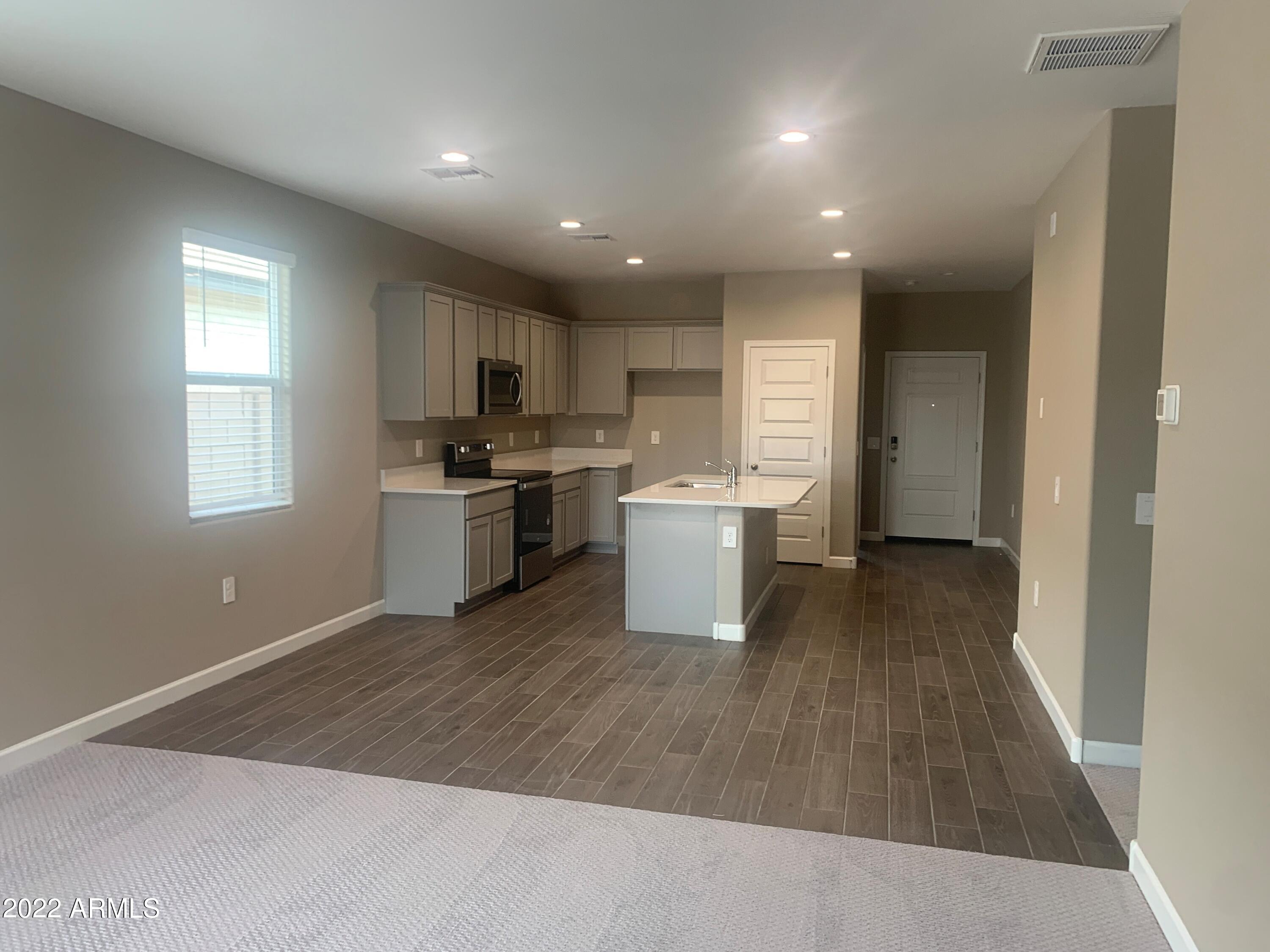 23944 West Ripple Road Buckeye, AZ 85326 - Photo 6 of 15 Great room 5