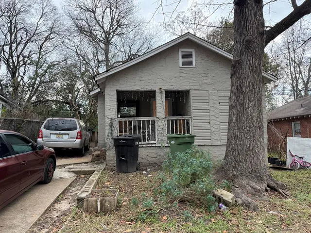 a front view of a house with yard