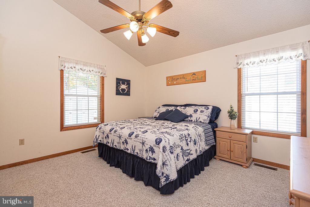54 Abbyshire Road Ocean Pines, MD 21811 - Photo 11 of 43 a spacious bedroom with a bed and a window