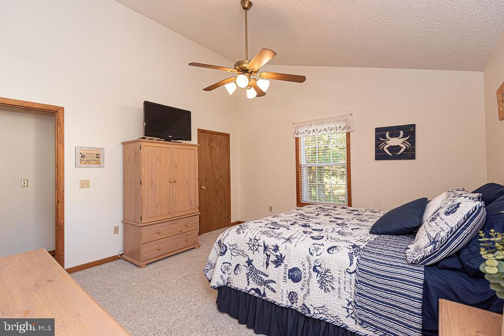 54 Abbyshire Road Ocean Pines, MD 21811 - Photo 12 of 43 a bedroom with a bed and a flat screen tv