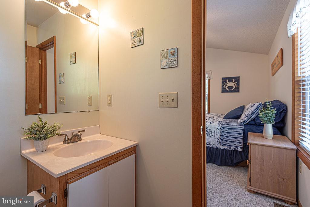 54 Abbyshire Road Ocean Pines, MD 21811 - Photo 15 of 43 a bathroom with a sink and a mirror