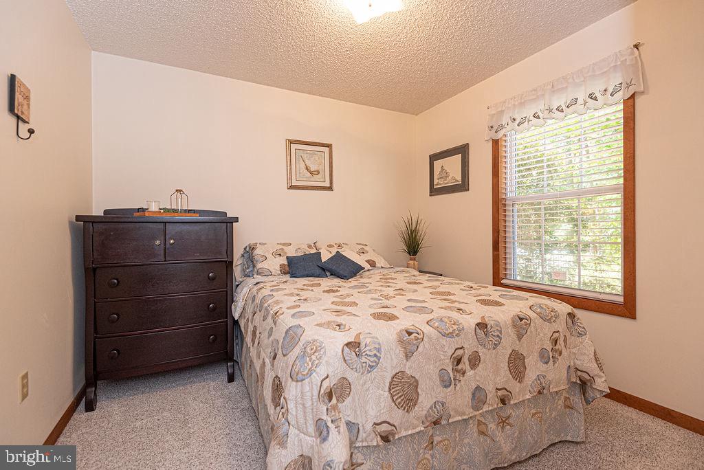 54 Abbyshire Road Ocean Pines, MD 21811 - Photo 16 of 43 a bedroom with a bed and window