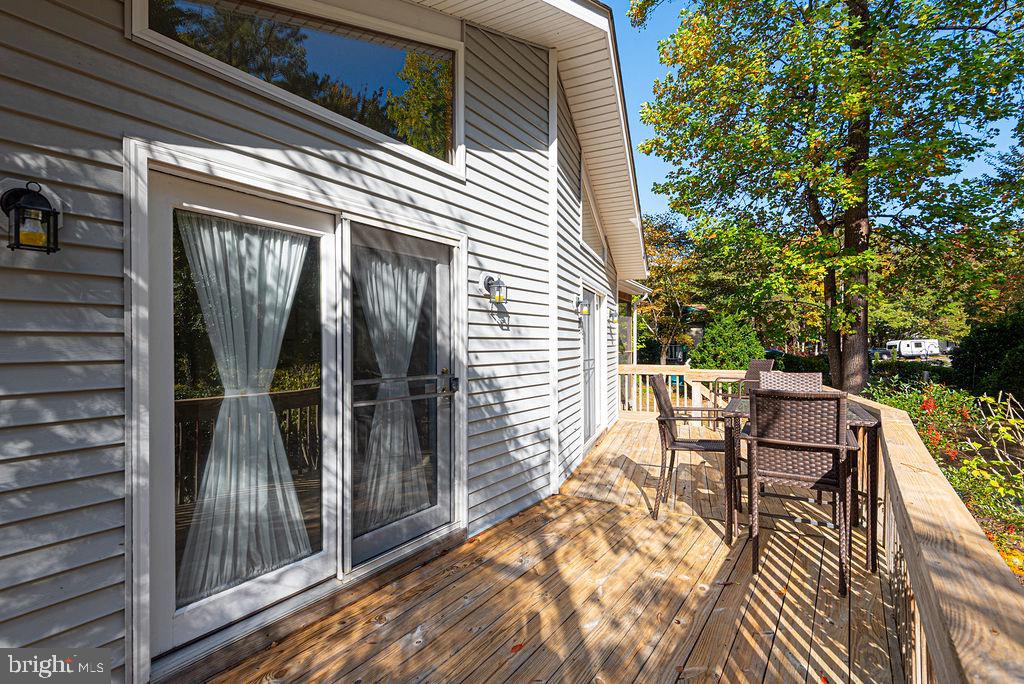 54 Abbyshire Road Ocean Pines, MD 21811 - Photo 2 of 43 a view of a patio with table and chairs and wooden floor
