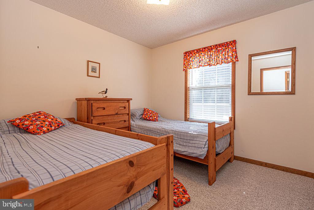 54 Abbyshire Road Ocean Pines, MD 21811 - Photo 21 of 43 a bedroom with a bed and a dresser