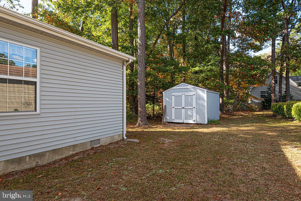 54 Abbyshire Road Ocean Pines, MD 21811 - Photo 27 of 43 a backyard of a house with a large tree