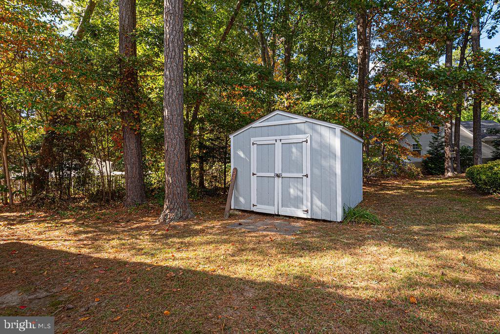 54 Abbyshire Road Ocean Pines, MD 21811 - Photo 28 of 43 a house with trees in the background