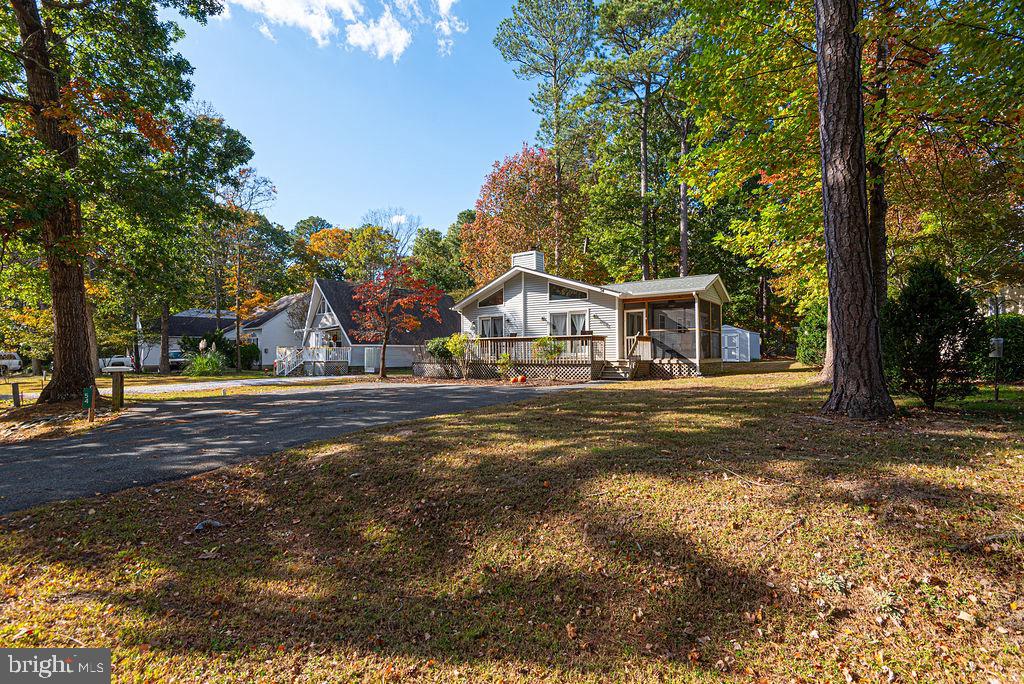 54 Abbyshire Road Ocean Pines, MD 21811 - Photo 31 of 43 a front view of a house with a garden and tree