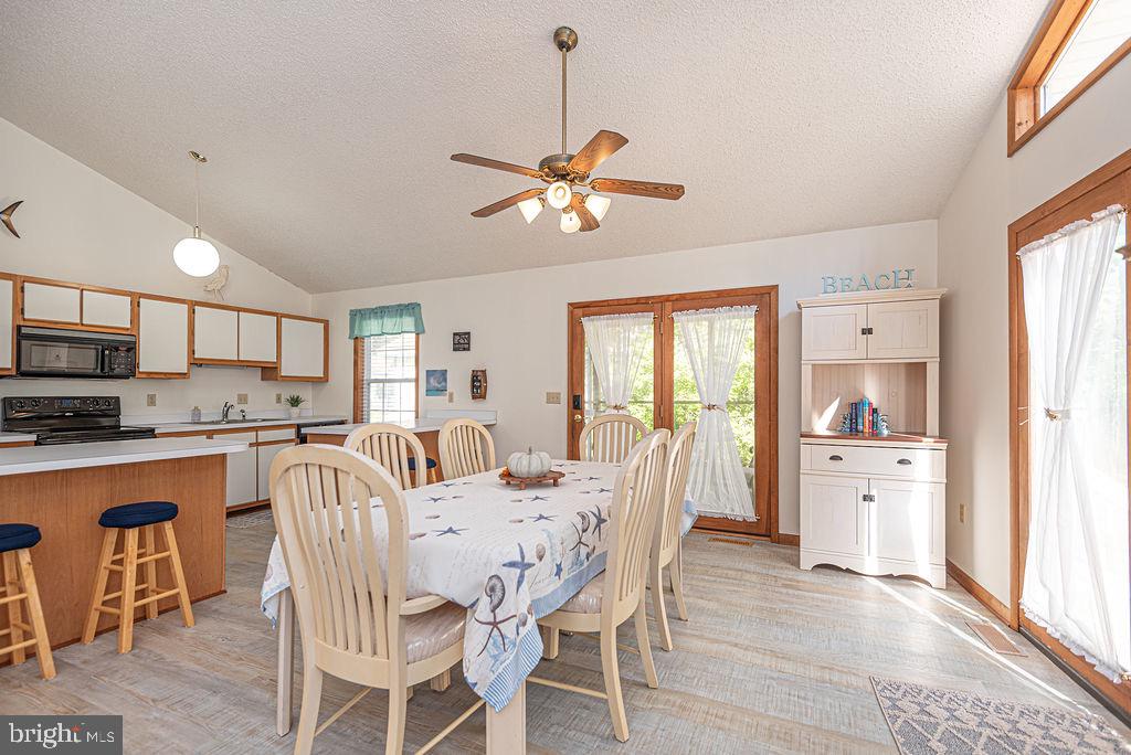 54 Abbyshire Road Ocean Pines, MD 21811 - Photo 5 of 43 a view of a dining room with furniture window and wooden floor