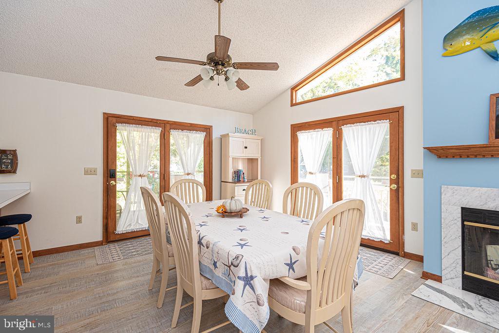 54 Abbyshire Road Ocean Pines, MD 21811 - Photo 6 of 43 a dining room with furniture a chandelier and wooden floor