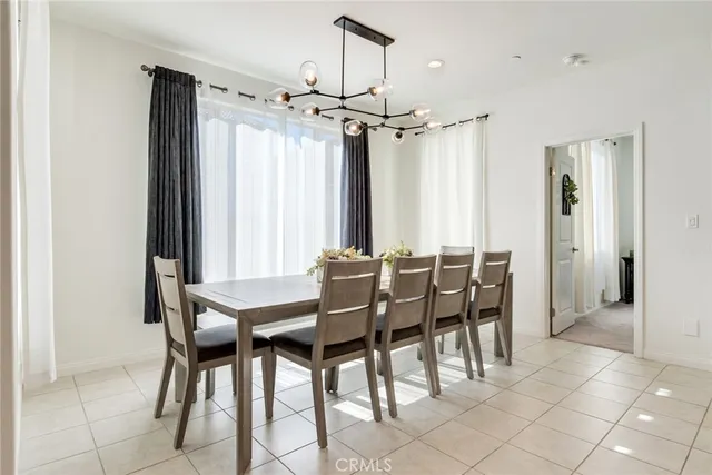 a view of a dining room with furniture and window