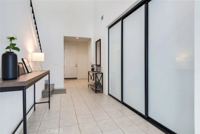 a view of hallway with furniture and entryway