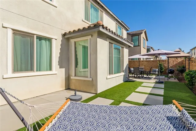 a view of house with yard porch and patio