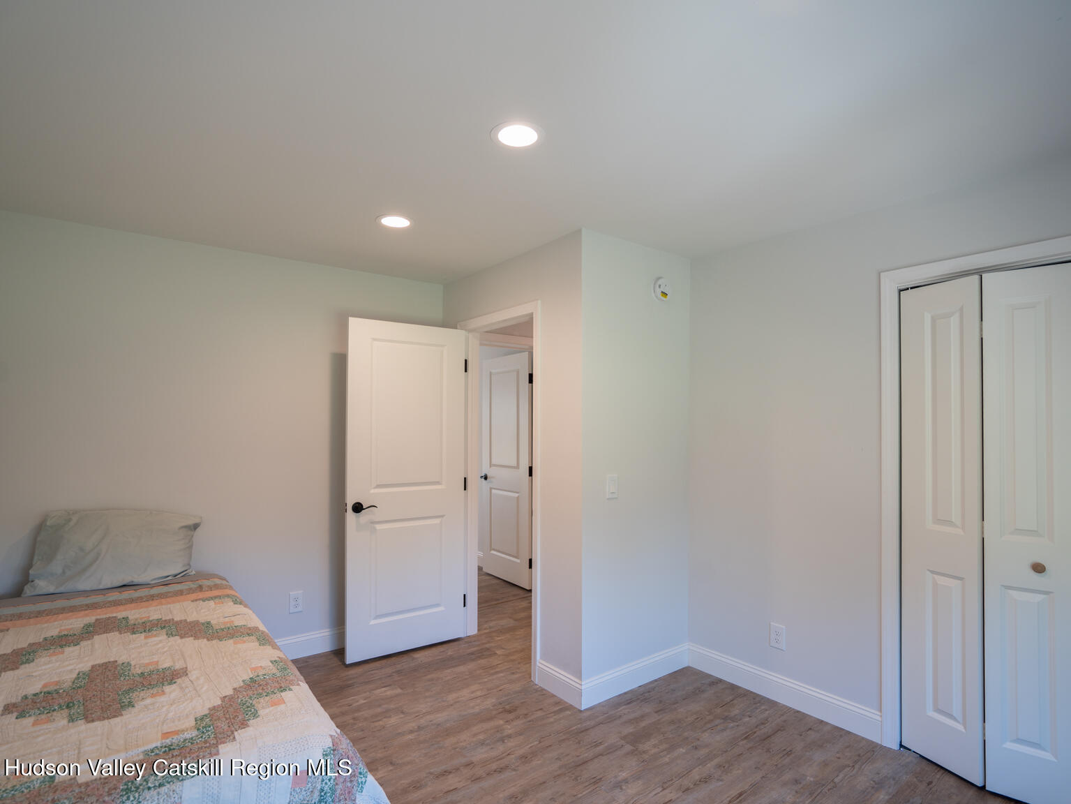 282 Ridge Road Stuyvesant, NY 12156 - Photo 21 of 65 a bedroom with a bed and wooden floor