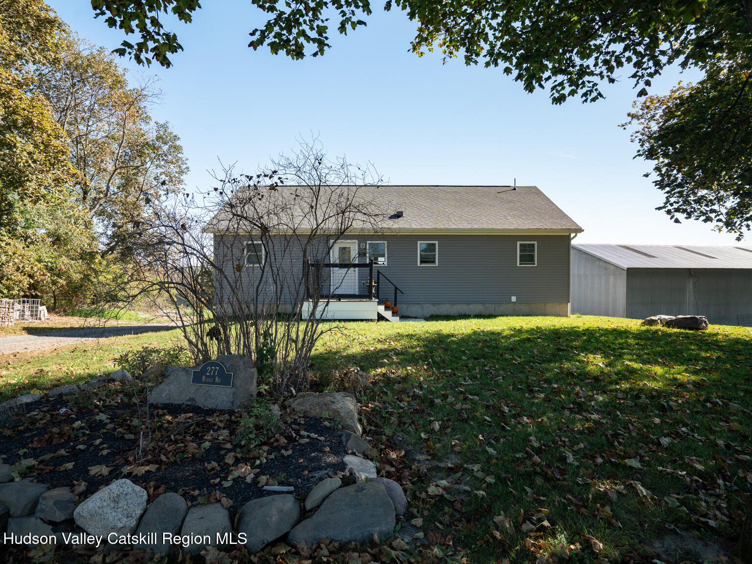 282 Ridge Road Stuyvesant, NY 12156 - Photo 50 of 65 a view of a house with a yard and a large tree