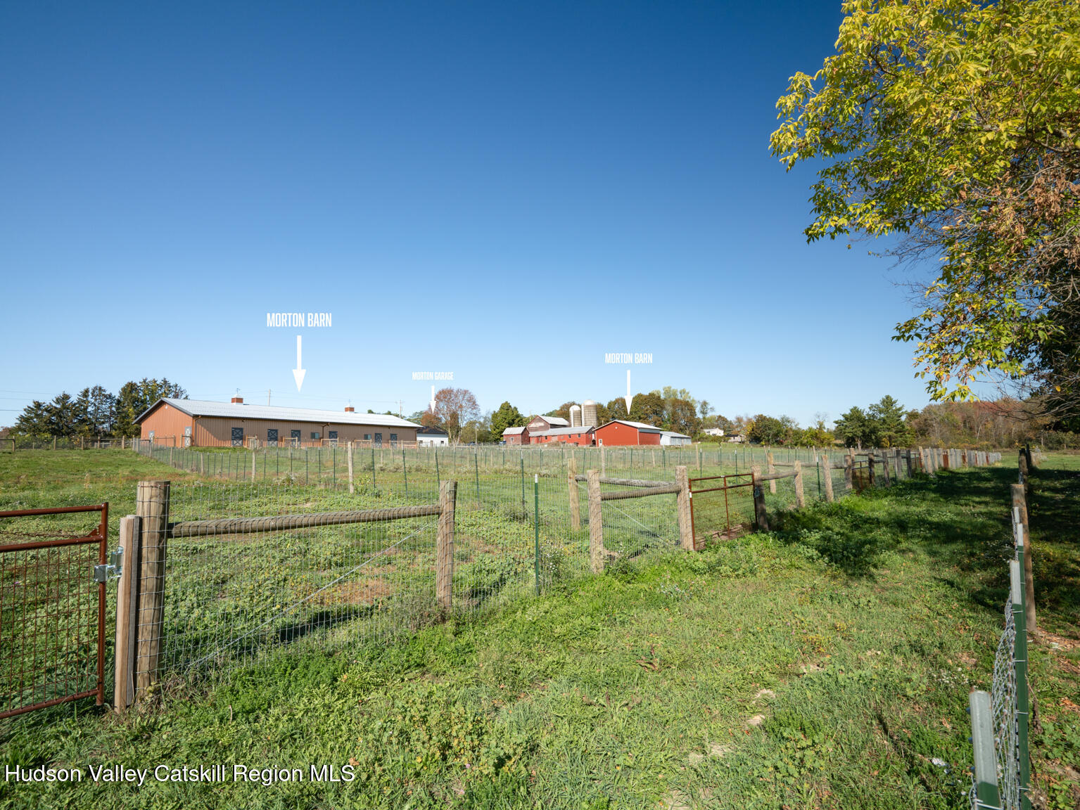 282 Ridge Road Stuyvesant, NY 12156 - Photo 54 of 65 a view of a green field with wooden fence