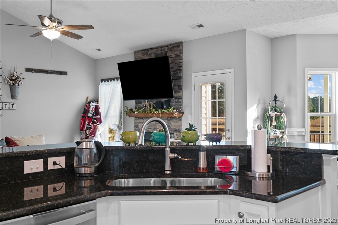 5654 Toby Pl Road Stedman, NC 28391 - Photo 13 of 42 a living room with furniture and a flat screen tv