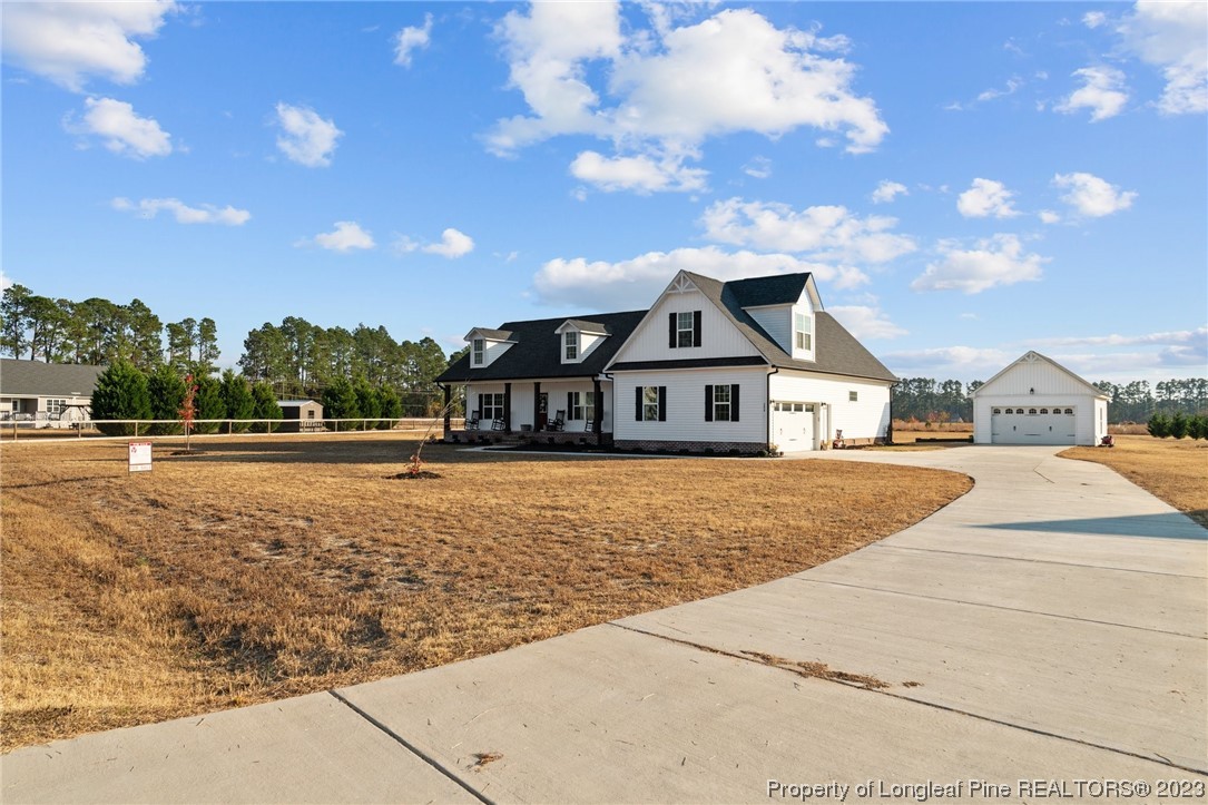5654 Toby Pl Road Stedman, NC 28391 - Photo 2 of 42 a front view of a house with a yard