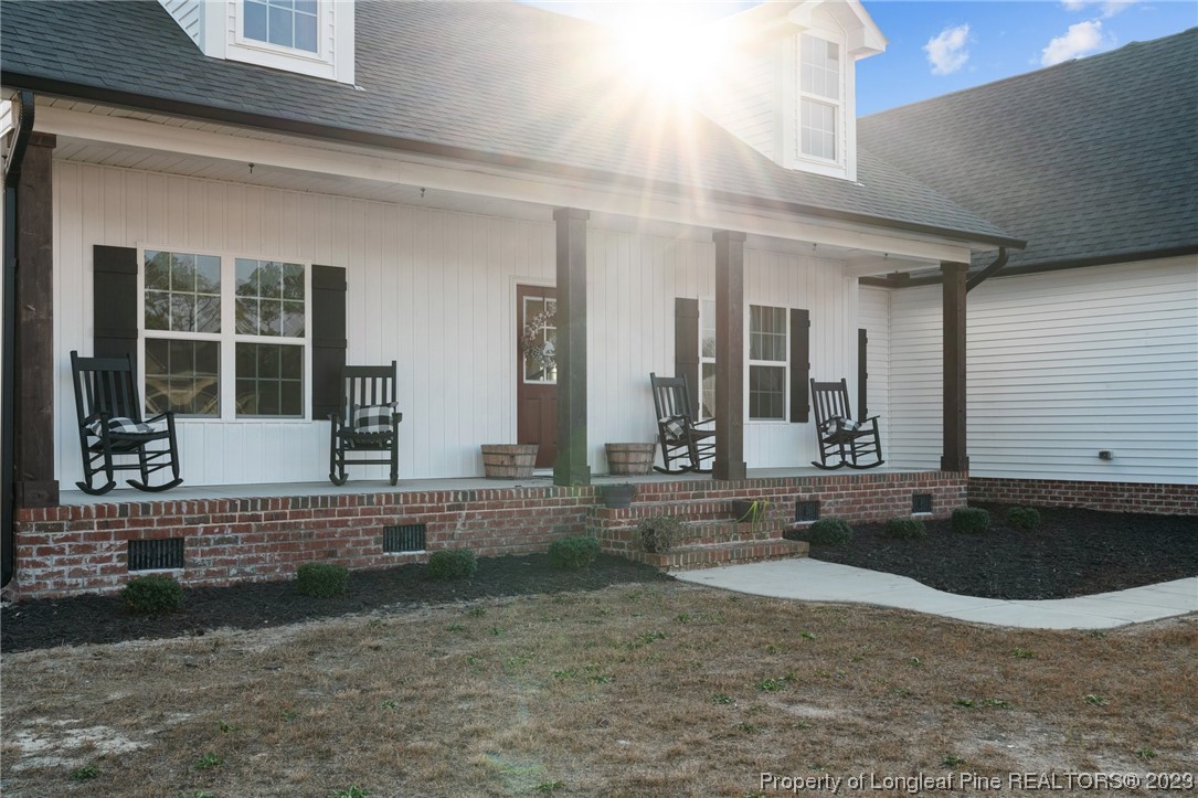 5654 Toby Pl Road Stedman, NC 28391 - Photo 33 of 42 a view of a house with a yard