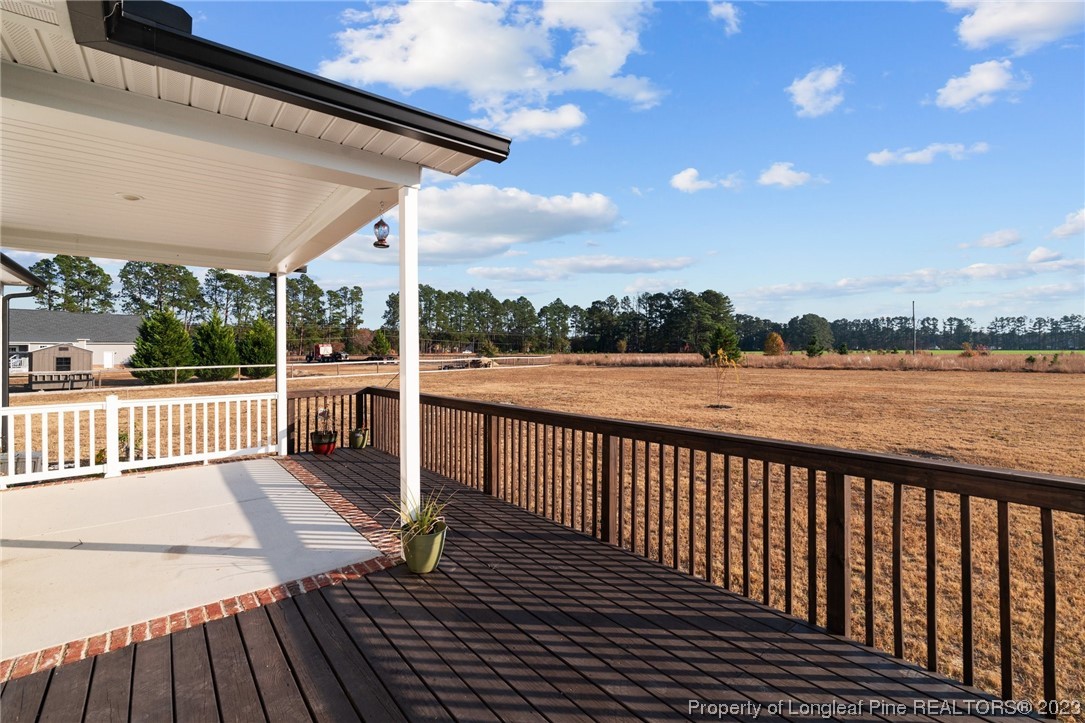 5654 Toby Pl Road Stedman, NC 28391 - Photo 37 of 42 a view of a balcony with wooden floor